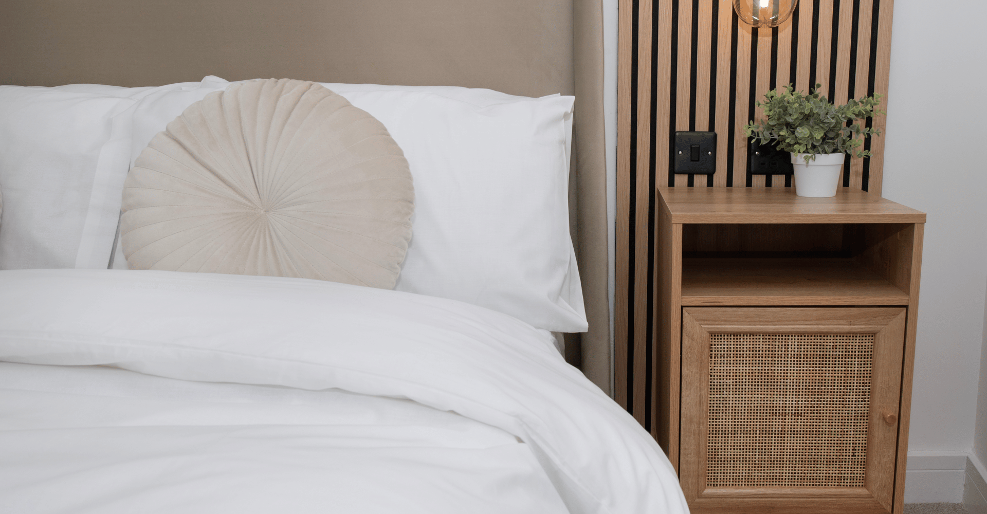 A closeup of the master bedroom bed