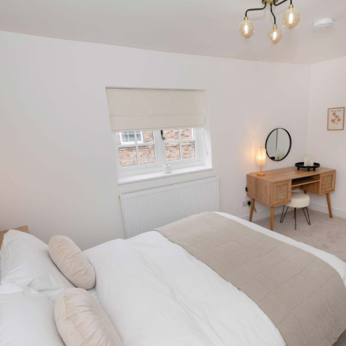 The Malt House master bedroom - view from behind the bed