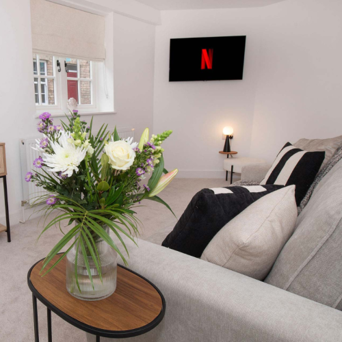 The Malt House living room sofa and TV